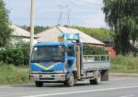 Автомобиль Nissan Diesel Condor с гидроманипулятором #С 510 КР 54. Новосибирск, улица Одоевского