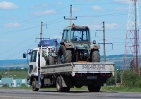 Перевозка трактора МТЗ-80 "Беларусь" в кузове грузовика Nissan Diesel Condor #К 695 ЕН 46. Белгородкая область, г. Алексеевка, Магистральная улица