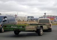Прицеп #АН 3037 55 в составе автопоезда. Тюмень, улица Мельникайте