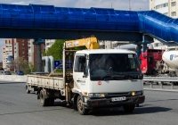 Бортовой грузовой автомобиль с КМУ Nissan #С 461 СА 86 . Тюмень, улица Федюнинского